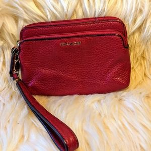 Small maroon Coach wristlet